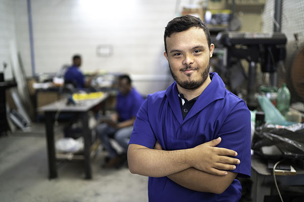 A man crossing his arms in a SAIT NDT lab