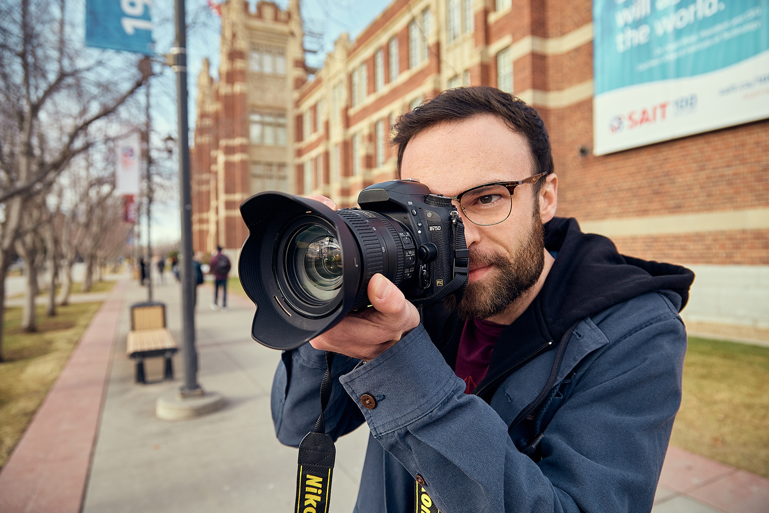 A man holding a dslr camera