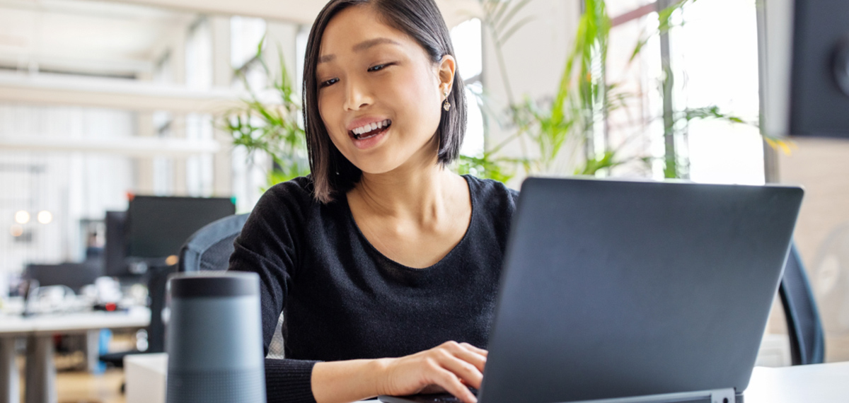 A student typing on a laptop